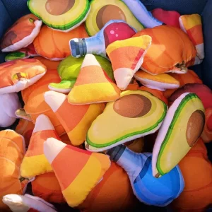 A pile of plush food and potion magnets