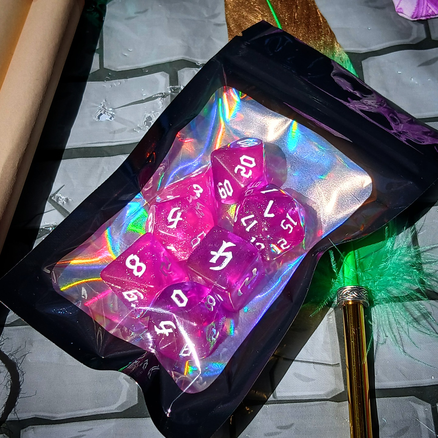 A set of sparkling purple polyhedral dice